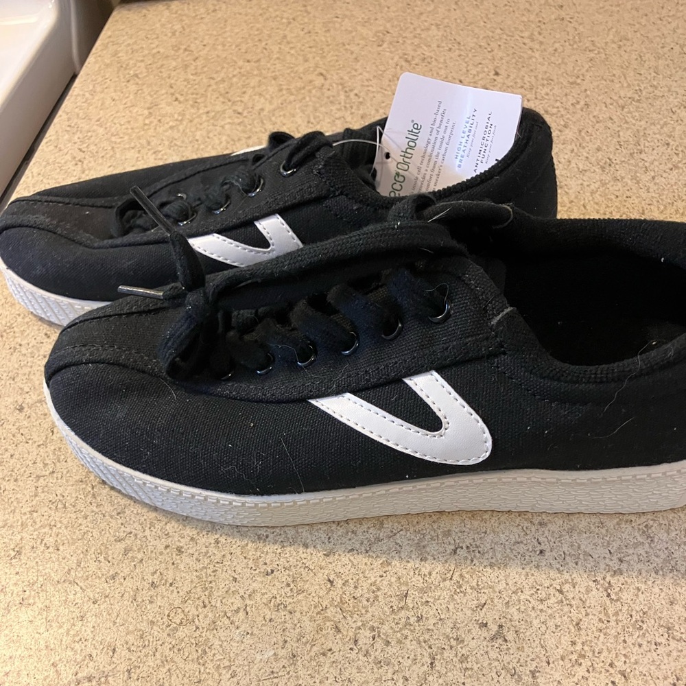 Tretorn Black Sneakers with White Soles women’s size 6 NWOT.